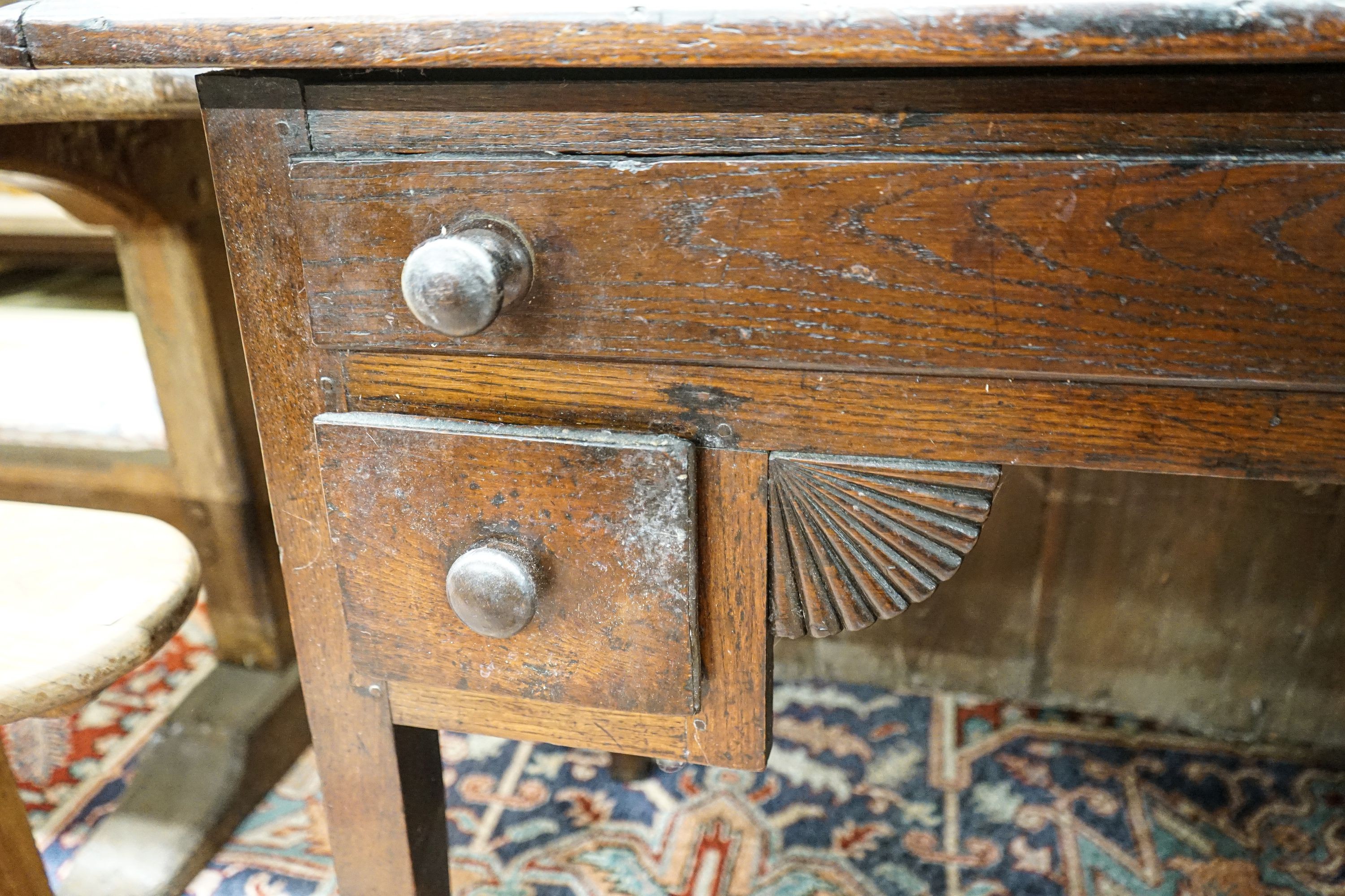 An early 19th century oak low boy, fitted three drawers, on square tapered legs, width 94cm, depth 55cm, height 77cm